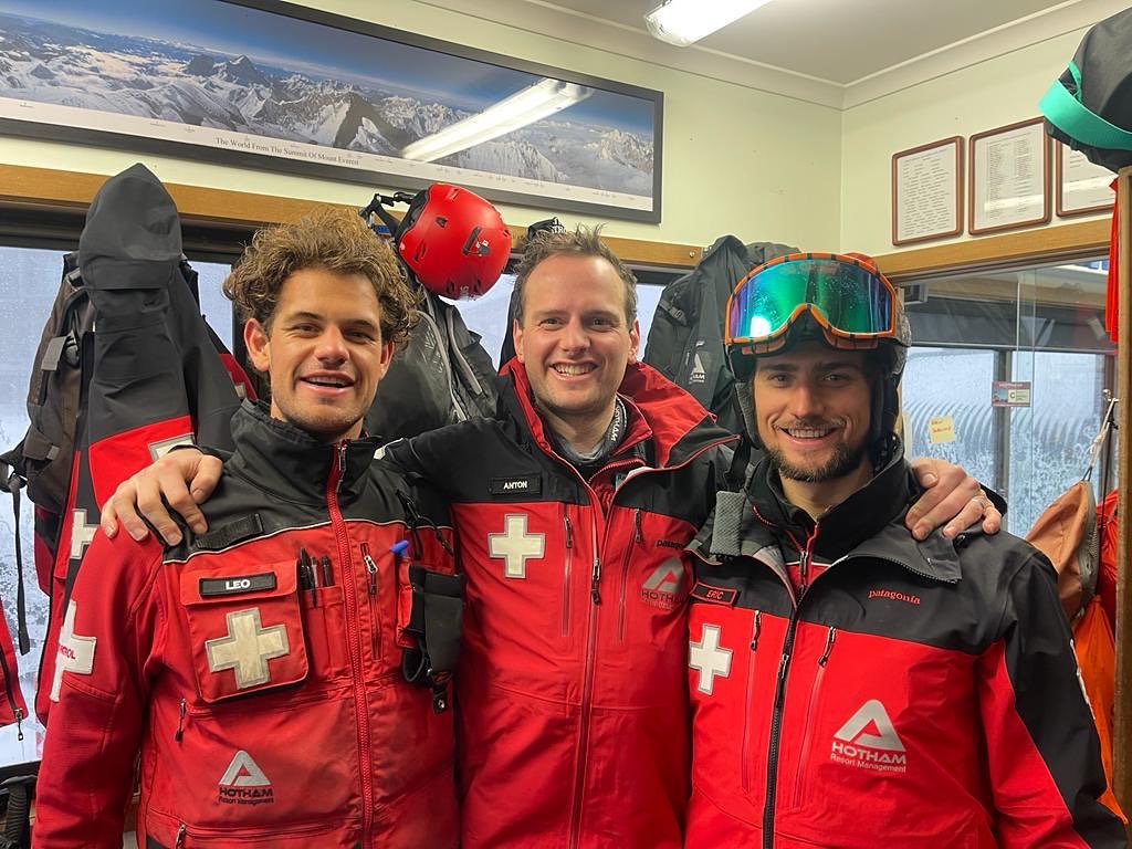 3 mt hotham ski patrollers standing side by side indoors