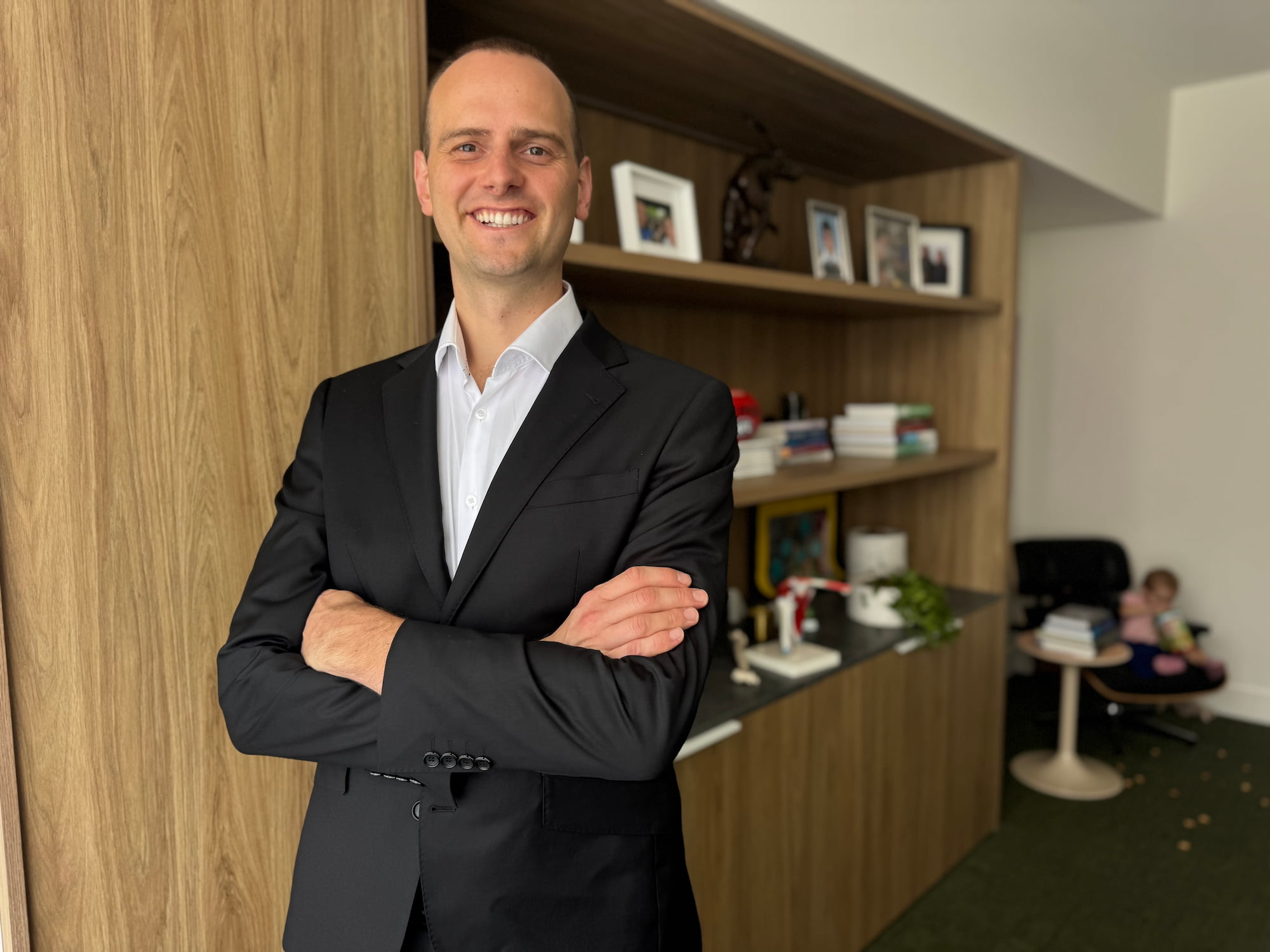 Photo of Dr Lambers in a suit in a consulting room